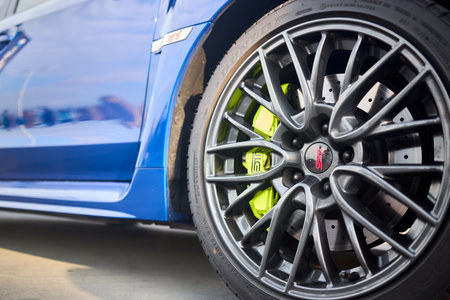 Berlin, Germany - August 20, 2022: Subaru Impreza WRX Sti detail shot. Sti badges logo emblem on wheel plug and on wing selective focus close up.のeditorial素材