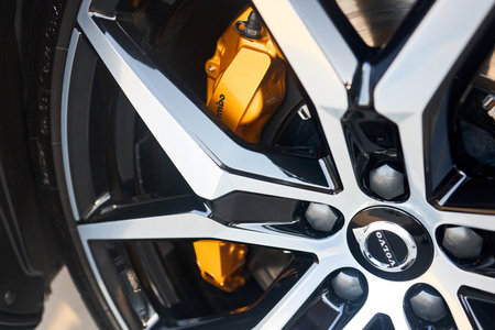 Berlin, Germany - August 20, 2022: Volvo badges logo emblem on alloy wheel plug and golden yellow brembo brake caliper selective focus close up.のeditorial素材
