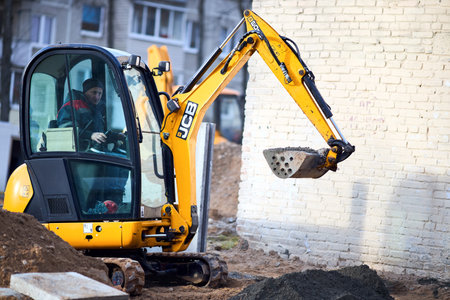 Grodno, Belarus - November, 22 2021: JCB 8018 CTS excavator digging sand and concrete at construction site. JCB mini excavator belongs to smallest machine segment in mini excavators category.のeditorial素材