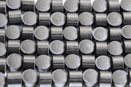 Zinc oxide chromium copper catalyst cylinder pellet form shape methanol synthesis industrial petrochemical background selected focus close up macro geometric ornamental shot.の写真素材