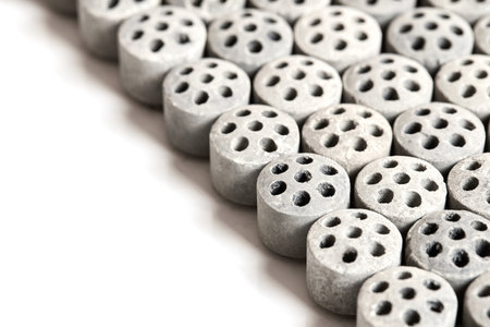 Carbon dioxide reforming of methane. Nickel catalyst seven holes cylinder pellet form shape methanol synthesis industrial petrochemical diagonal view close up shot texture background with copyspace.の写真素材