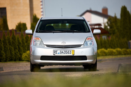Berlin, Germany - May, 3 2024: Toyota Prius XW20 2009 hybrid electric car over out of focus rural background, front viewのeditorial素材