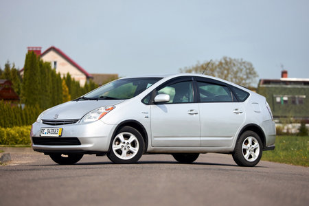 Berlin, Germany - May, 3 2024: Toyota Prius XW20 2009 hybrid electric car over out of focus rural background, three quarter front viewのeditorial素材
