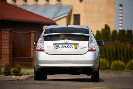 Berlin, Germany - May, 3 2024: Toyota Prius XW20 2009 hybrid electric car over out of focus rural background, rear back viewのeditorial素材