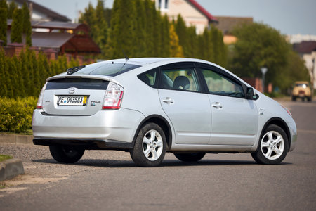 Berlin, Germany - May, 3 2024: Toyota Prius XW20 2009 hybrid electric car over out of focus rural background, three quarter rear back viewのeditorial素材