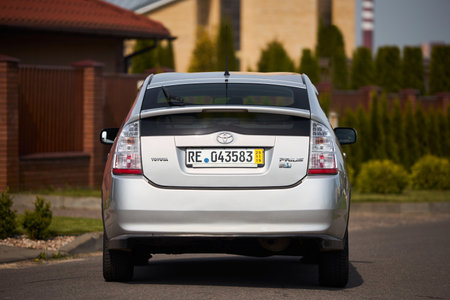 Berlin, Germany - May, 3 2024: Toyota Prius XW20 2009 hybrid electric car over out of focus rural background, rear back viewのeditorial素材