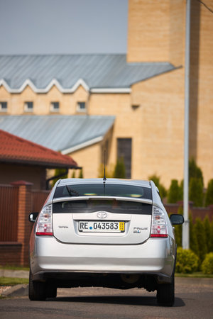 Berlin, Germany - May, 3 2024: Toyota Prius XW20 2009 hybrid electric car over out of focus rural background, rear back view vertical shotのeditorial素材