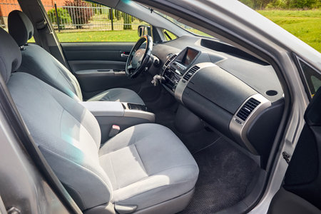 Berlin, Germany - May, 3 2024: Toyota Prius XW20 2009 hybrid electric car interior design with steering wheel dashboard gearbox and multimedia system view from passenger doorのeditorial素材