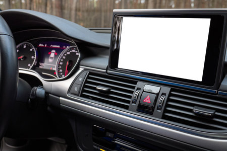 Monitor in car isolated blank screen for navigation maps and GPS rearview camera and parking assistant. Car display with blank white screen for design mock up, copy space.の写真素材