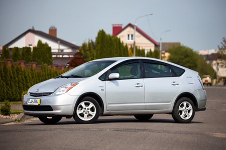 Berlin, Germany - May, 3 2024: Toyota Prius XW20 2009 hybrid electric car over out of focus rural background, three quarter front viewのeditorial素材