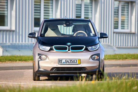 Berlin, Germany - May, 4 2024: BMW i3 Range Extender REx 2015 electric B class high roof hatchback selective focus over out of focus urban background front side view.のeditorial素材