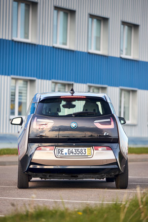 Berlin, Germany - May, 4 2024: BMW i3 Range Extender REx 2015 electric B class high roof hatchback selective focus over out of focus urban background rear back side view vertical shot.のeditorial素材