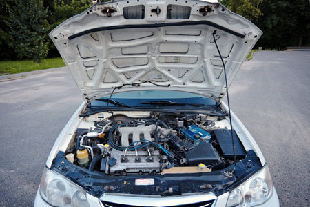 Berlin, Germany - JULY, 2 2013: Pearl white Mazda Millenia or Mazda Xedos 9 detailing engine bay with V6 DOHC engine with opened engine hood.のeditorial素材