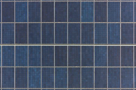 Many solar panels texture. Building with lots of solar panels. Renewable solar energy. Alternative Generator Energy efficient house uses solar energy of sunの写真素材