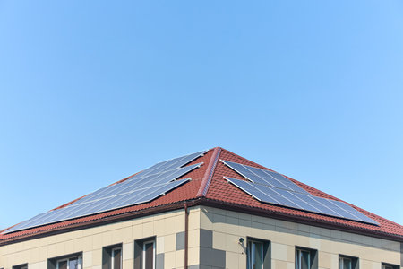 Solar panels on roof with copyspace. Building with lots of solar panels. Renewable solar energy. Alternative Generator Energy efficient house uses solar energy of sunの写真素材