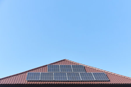 Solar panels on roof with copyspace. Building with lots of solar panels. Renewable solar energy. Alternative Generator Energy efficient house uses solar energy of sunの写真素材