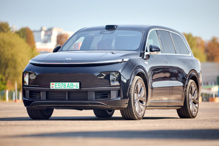 Minsk, Belarus - September, 18 2024: Brand new Li L9 lixiang luxury full-size crossover SUV by Chinese manufacturer Li Auto 2022 present, parked over urban backgroundのeditorial素材