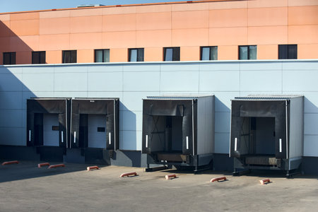 Loading dock or loading bay with bumpers, levelers, lift, dock seals or shelters, Loading bay is area of building goods where vehicles road or rail are loaded and unloaded.の写真素材