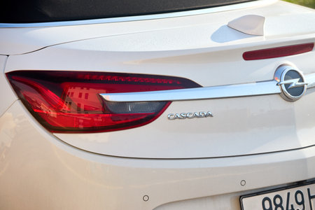 Minsk, Belarus - September, 18 2024: Opel Cascada cabrio,four-passenger fabric roof convertible, manufactured and marketed by Opel for model years 2013-2019 rear logo badge.のeditorial素材
