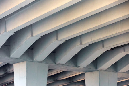 Reinforced Concrete Structure of Highway Overpass. View From Bottom Down. Concrete beams under the bridge. Under overpass, cement beams pillars support the weight concrete slabs.の写真素材
