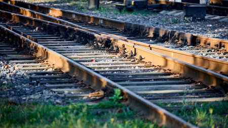 Large empty railroad crossing without fork. Concept of industrial logistic and transportation background with selective focus on intersection with copy space 16x9.の写真素材