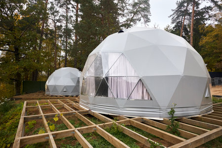 Geodesic domes for glamping and camping, thin-shell structure lattice shell based on geodesic polyhedron. Glamping is glamorous and camping, style of camping with amenities and resort style services.の写真素材