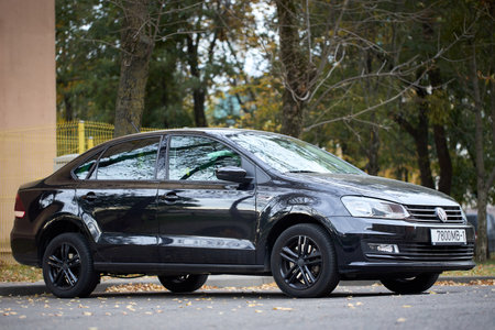 Minsk, Belarus - October, 22 2024: black Volkswagen Polo Sedan I, compact sedan car parked, front right side viewのeditorial素材