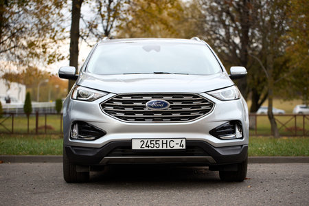 Minsk, Belarus - October, 22 2024: Ford Edge II 2nd generation crossover SUV manufactured Ford Motor Company 2015 to 2024 mid size CUV. Front view selective focus shot.のeditorial素材