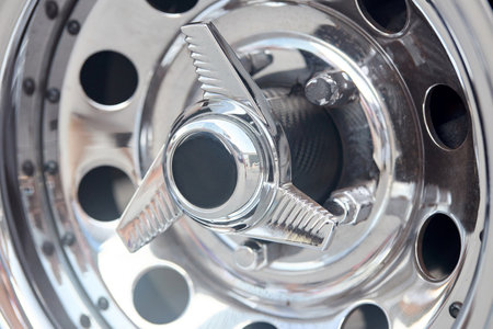 Muscle car detail closeup nickel plated alloy wheel side viewの写真素材
