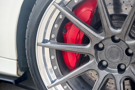Forged aluminum wheels with Red Brake Calipers selected focus closeup shotの写真素材