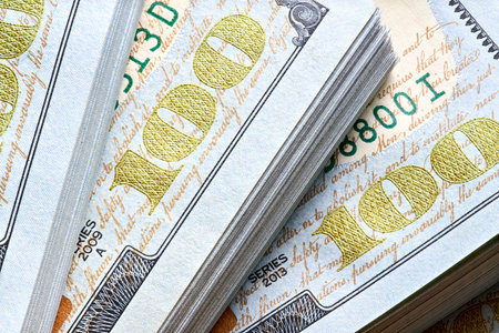 New US Dollar USD 2009 series bill bundles background for design. Many bundle of US 100 dollars bank notes.の写真素材
