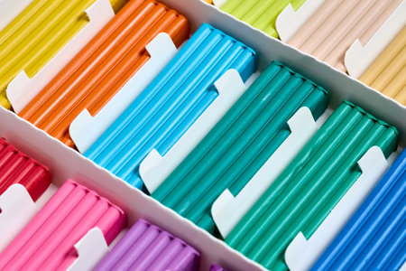 Artistic plastic clay for modeling in a box. Children multicolored plasticine modeled for learning craft. Art of modeling material close up.の写真素材