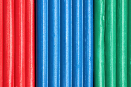 Artistic plastic clay for modeling in a box. Children red green blue RGB plasticine modeled for learning craft. Art of modeling material close up.の写真素材