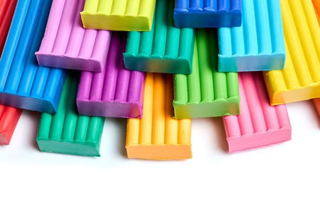Artistic plastic clay for modeling. Children multicolored plasticine three levels pile for learning craft. Art of modeling material close up.の写真素材