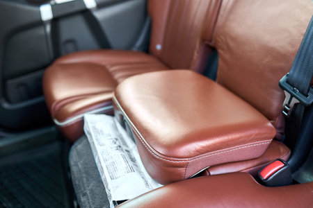 Berlin, Germany - February, 2 2021: Volvo XC90 2.5 1st generation Twilight Bronze 2002-2014 restyling 4WD 4 wheel 4x4 SUV integrated child booster seat is an option for the second row center positionの写真素材