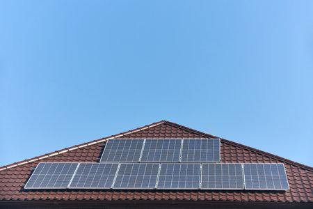 Solar panels on roof with copyspace. Building with lots of solar panels. Renewable solar energy. Alternative Generator Energy efficient house uses solar energy of sunの写真素材