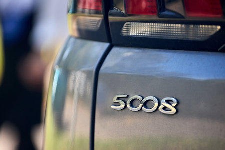 Minsk, Belarus - September, 18 2024: Peugeot 5008 Second generation P87 2017-2024 detailing taillight and 5008 emblem badge shield logo selective focus closeup.のeditorial素材