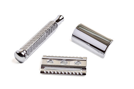 Three piece razors details top of cutting head, base and handle. Safety Double-Edge DE Razor with closed comb isolated on white focus stacking shot. Classic Wet Shaving Supplies and Accessories.の写真素材