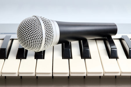 Microphone on midi piano keyboard keys. Recording studio conceptの写真素材