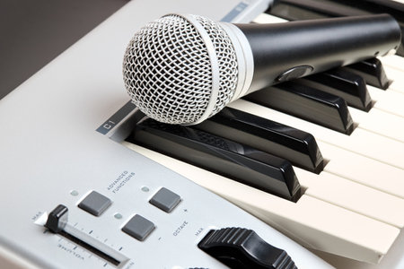 Microphone on midi piano keyboard keys. Recording studio conceptの写真素材