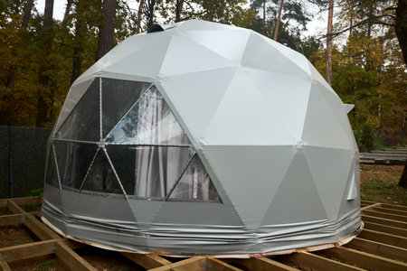 Geodesic dome for glamping and camping, thin-shell structure lattice shell based on geodesic polyhedron. Glamping is glamorous and camping, style of camping with amenities and resort style services.の写真素材