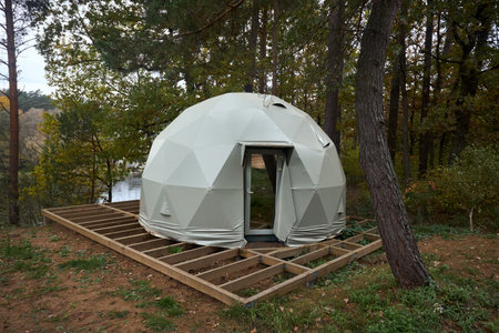 Geodesic dome for glamping and camping, thin-shell structure lattice shell based on geodesic polyhedron. Glamping is glamorous and camping, style of camping with amenities and resort style services.の写真素材