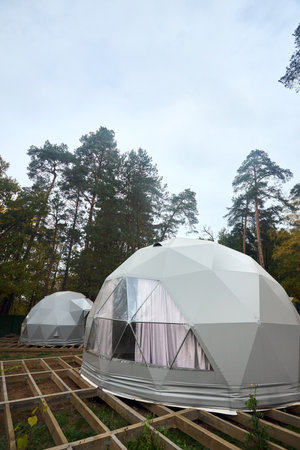 Geodesic domes for glamping and camping, thin-shell structure lattice shell based on geodesic polyhedron. Glamping is glamorous and camping, style of camping with amenities and resort style services.の写真素材