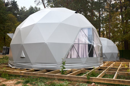 Geodesic domes for glamping and camping, thin-shell structure lattice shell based on geodesic polyhedron. Glamping is glamorous and camping, style of camping with amenities and resort style services.の写真素材