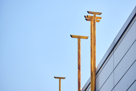Yellow chimney pipes natural gas duct pipeline of industrial boiler room furnace over clear blue sky background with copyspaceの写真素材