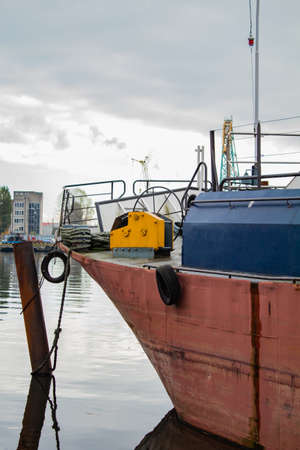 Red ship in cargo port in the morningの写真素材