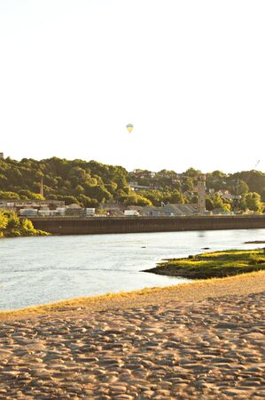 Sunset and hot air balloon by river in Kaunasのeditorial素材