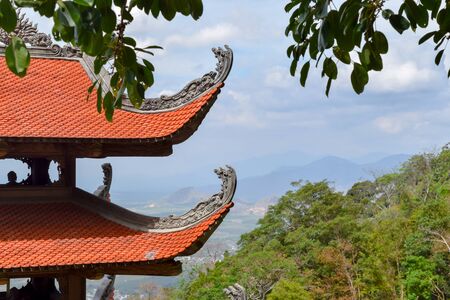 Linh Truong Tho Pagoda roof with beautiful landscape view of Vietnam behind it from ta Cu mountainの写真素材