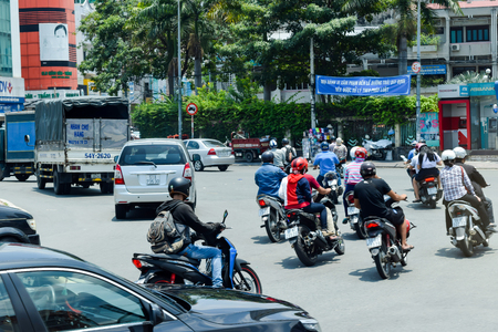 VIETNAM - APRIL 4: Road traffic of thousands of scooters and cars during traffic rush hours on April 4, 2017 in Vietnam, Ho Chi Minh Cityのeditorial素材