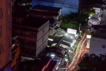 Vietnam, Ho Chi Minh city - 5 April 2017. View of the night city life from hotel roof. Photo taken with long exposureのeditorial素材
